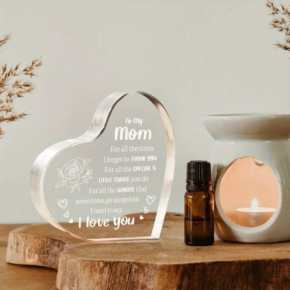 A heart-shaped clear acrylic keepsake engraved with 'To my mom I forgot to thank you for the special things you do For all th