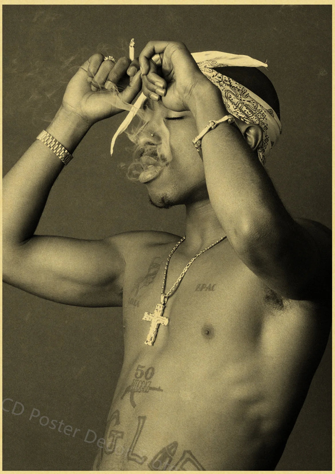 A black and white portrait of a man with facial hair and a bandana, holding his hands near his face.