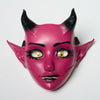 A pink horned fantasy creature mask with detailed facial features and movable jaw.