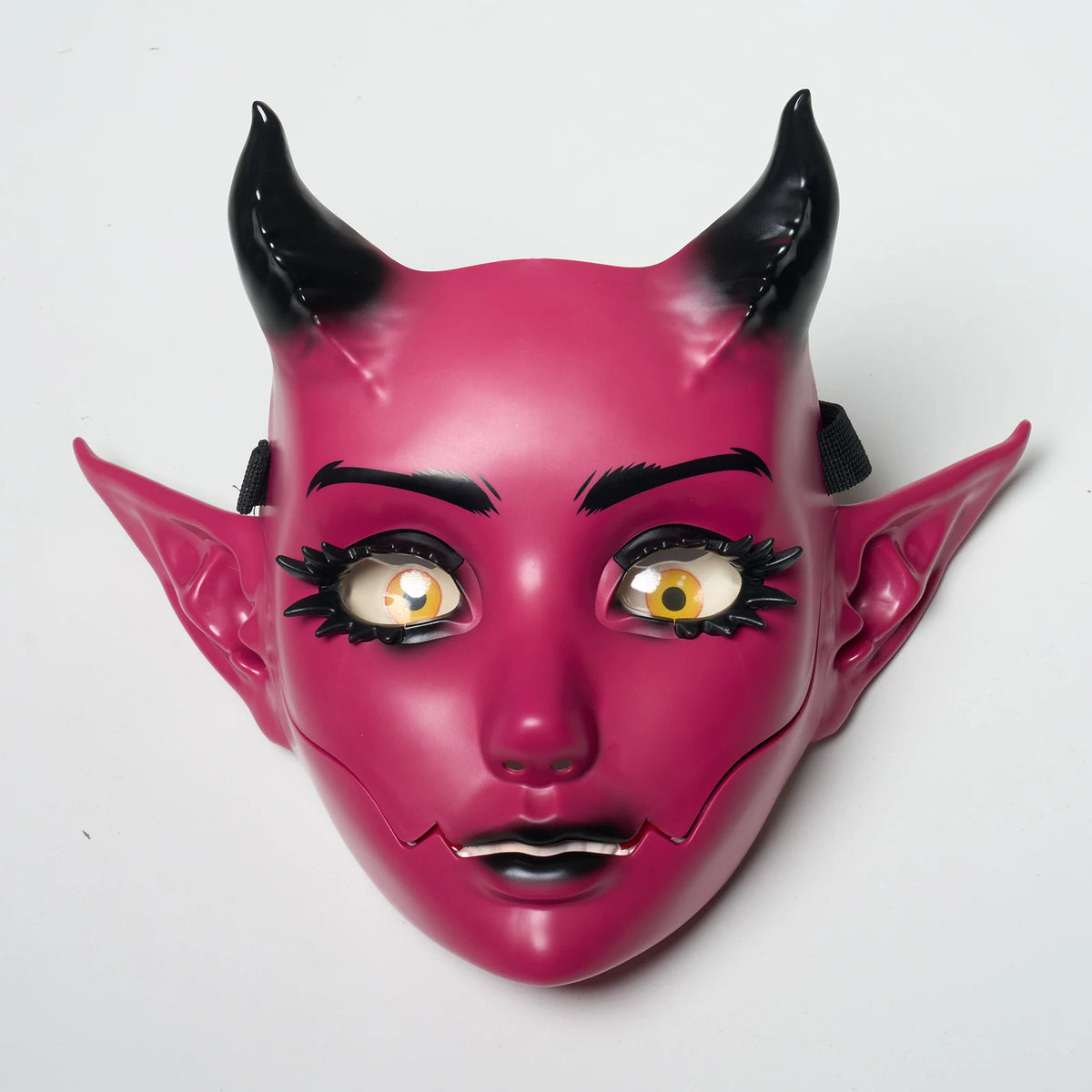 A pink horned fantasy creature mask with detailed facial features and movable jaw.