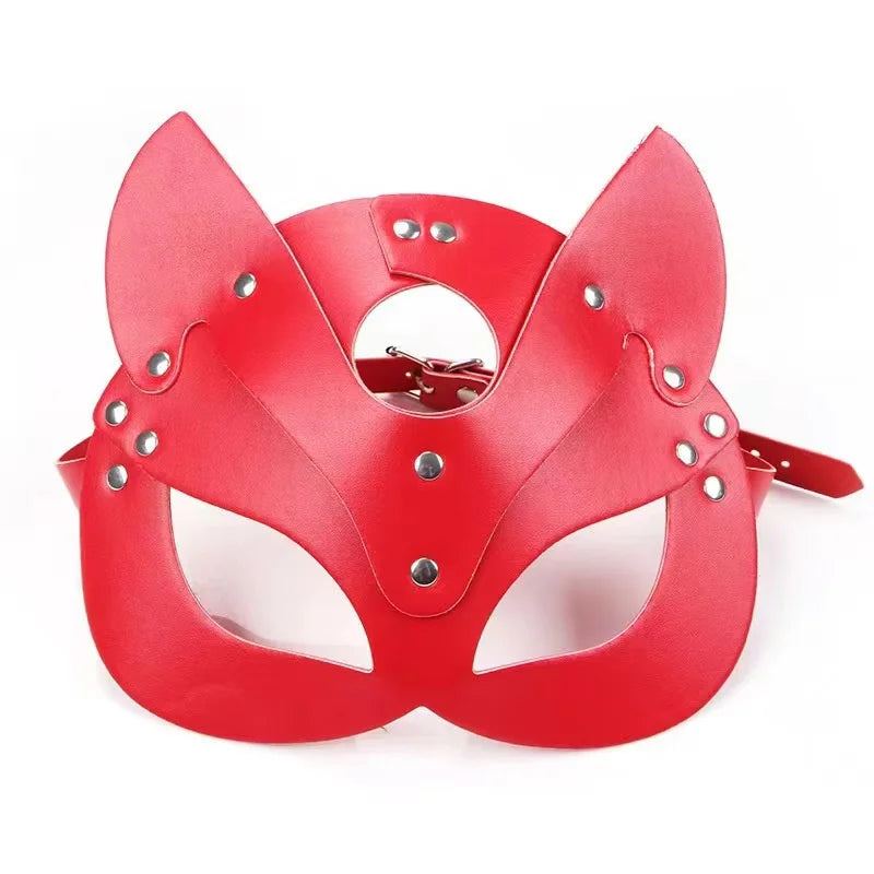 A red fox-eared masquerade mask made of faux leather with silver studs and an adjustable strap.