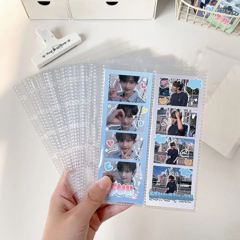 A hand holds a vertical transparent photocards holder displaying several idol photos.