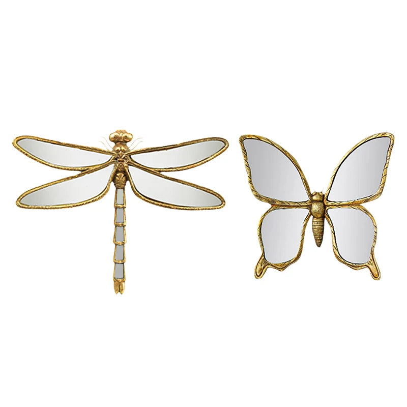 Artisan butterfly wall mirror with an antique gold frame featuring a detailed insect design.