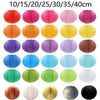 A collection of decorative paper lanterns in various colors and sizes, including red, pink, orange, yellow, purple, blue, gre