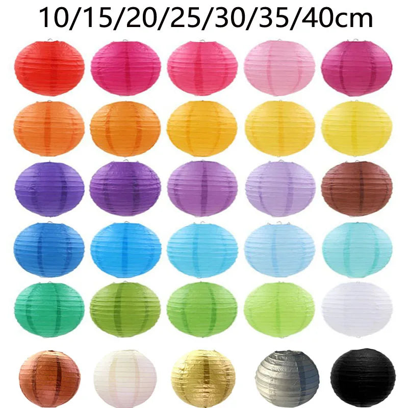 A collection of decorative paper lanterns in various colors and sizes, including red, pink, orange, yellow, purple, blue, gre