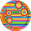 A colorful circular pattern featuring vibrant stripes and starburst shapes in pink, green, yellow, and red.