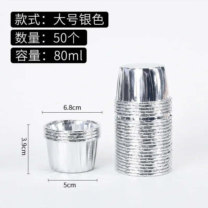A stack of 50 silver greaseproof cupcake liners, each measuring 80ml and 6.8cm high.