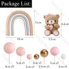 A set of boho rainbow cake toppers featuring pink ball decorations and various sized paper straws.