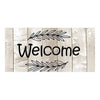 A rustic wooden sign with the word Welcome written in black script surrounded by leafy branches.