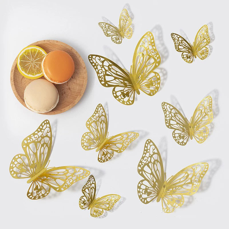 A set of gold, intricate butterfly wall decor cutouts displayed on a white background.