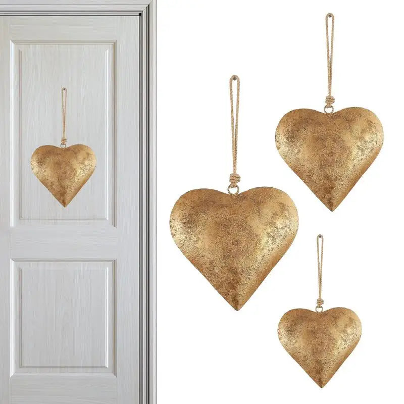 Antique golden metal heart wall decor hanging on a white door