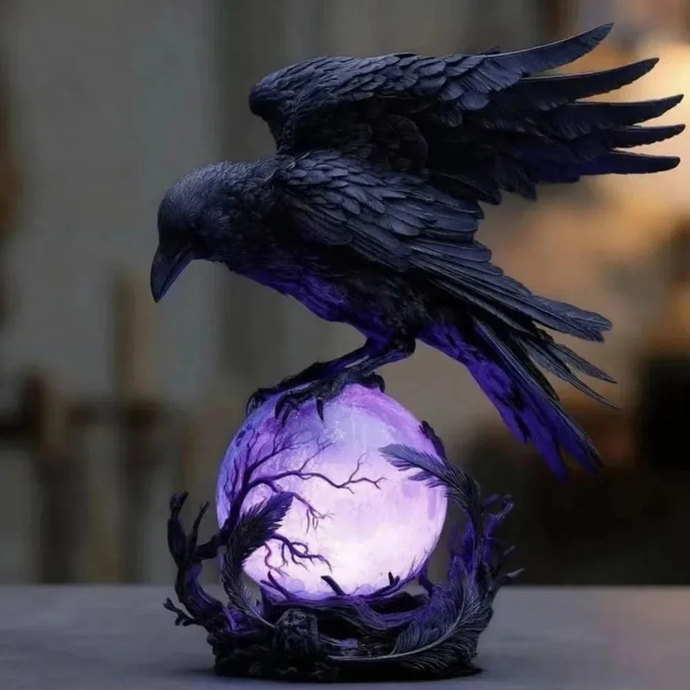 A dark raven sculpture with purple glow perched on a branch, illuminated by an LED light.