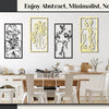 A set of four black and yellow abstract female line art prints displayed on a white wall above a wooden dining table.