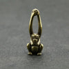 Vintage brass monkey key chain charm with a detailed, sculpted figure.