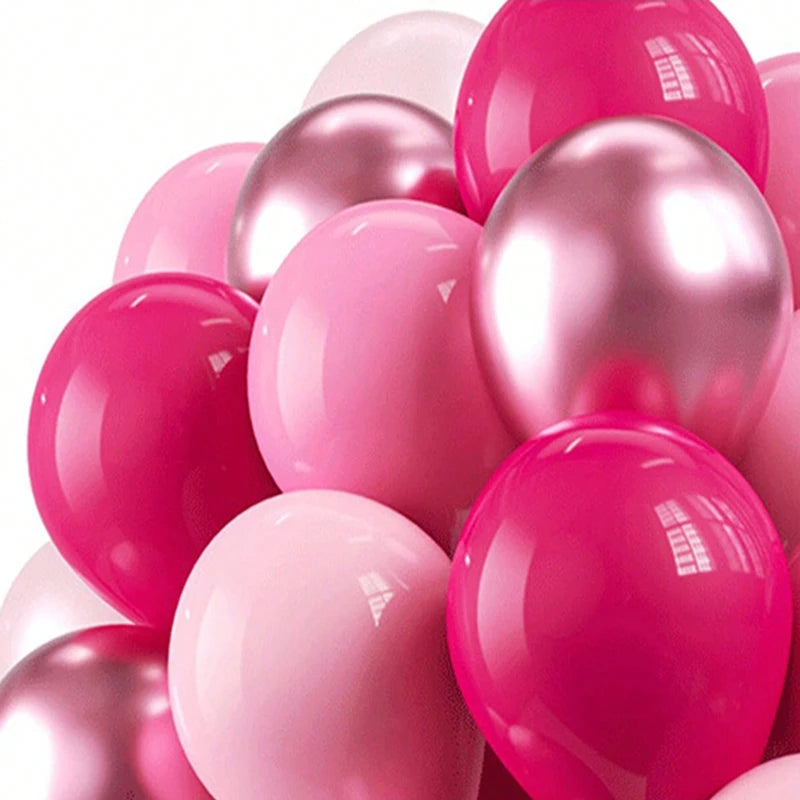 A close-up of a pack of shimmering pink latex balloons in various shades and sizes.