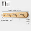 Solid beech wood wall hook rack with four wooden hooks and a packaging display.