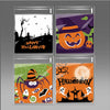 A set of four Halloween-themed cellophane treat bags featuring jack-o'-lanterns, spiders, bats, and spooky designs.
