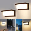 A vintage LED rectangle wall sconce with a rectangular light panel mounted on a white wall.