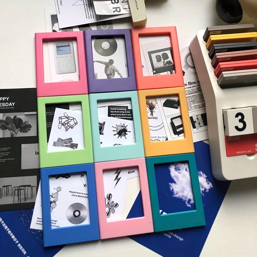 A collection of colorful retro magnetic photo frames displaying various photographs and negatives.