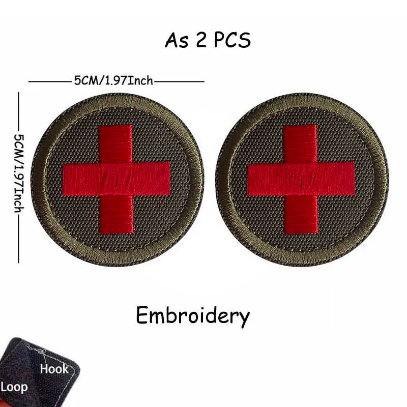 Two embroidered medical cross tactical morale patches, 5cm in diameter each.