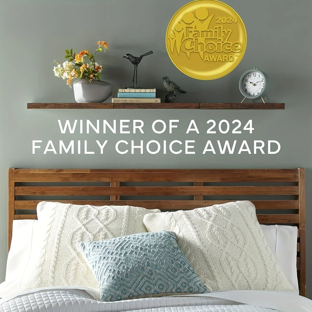 A bedroom display featuring wooden floating wall shelves with hidden brackets, a gold award, and decorative items.