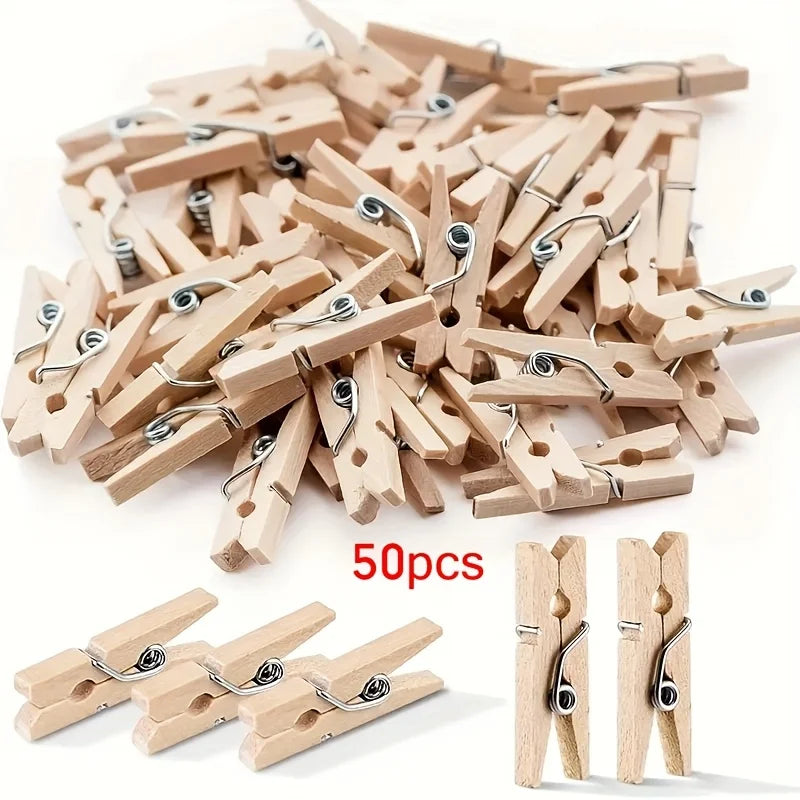 A pile of 50 wooden mini clothespins in natural wood color, showing various sizes and styles.