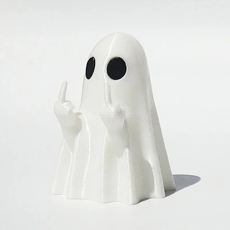 A white glow-in-the-dark ghost figurine with a playful pointing pose.
