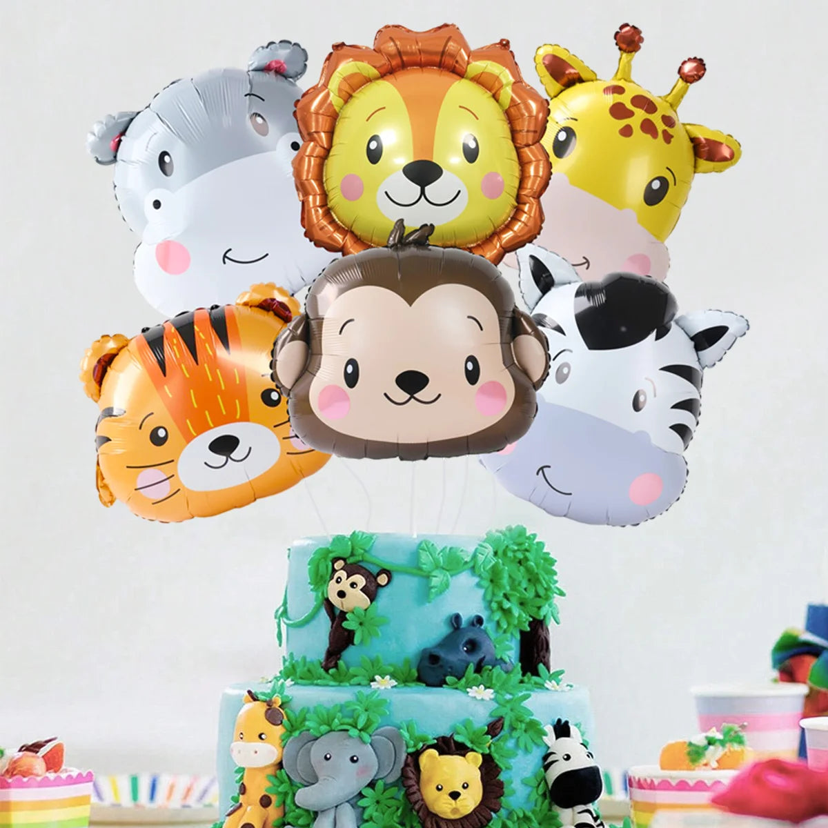 A collection of foil balloons featuring cartoon jungle safari animals like a monkey, tiger, and lion.