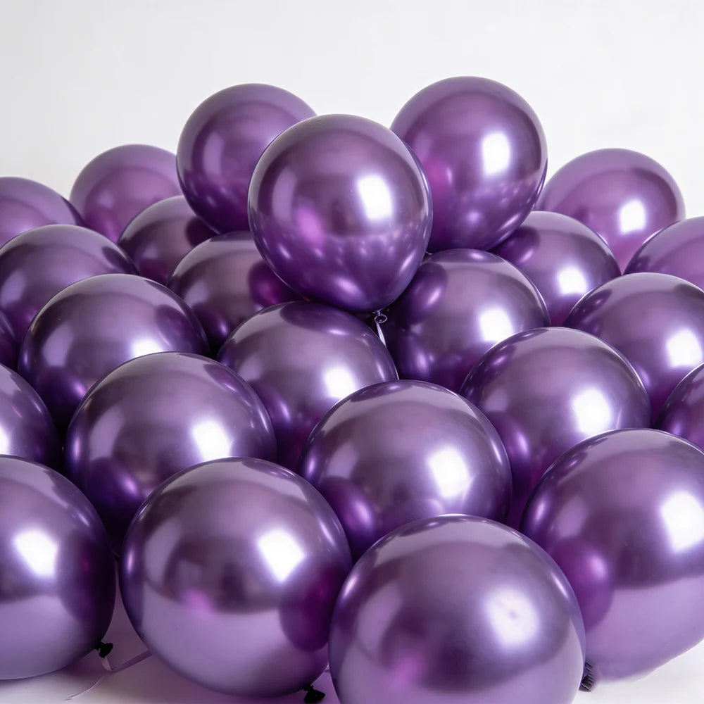 A pile of chrome metallic purple balloons used for celebrations.