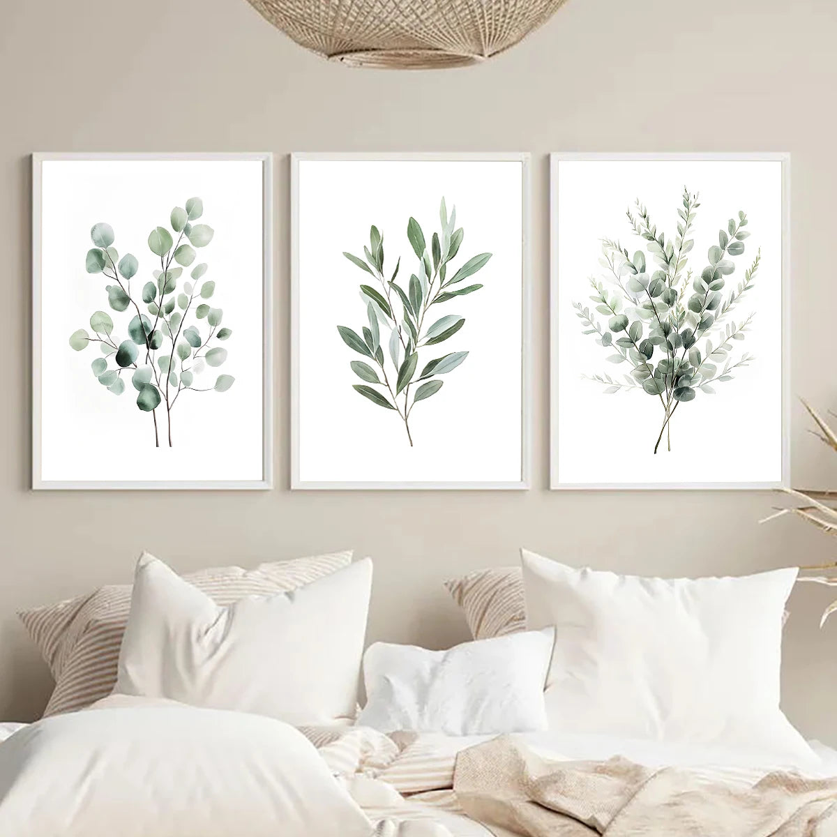A set of three framed botanical leaf art prints featuring sage green foliage on white backgrounds.