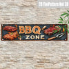 A rustic metal sign with BBQ ZONE text and images of grilled meat on a stone wall.
