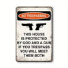 A vintage warning sign with a black and orange design stating NO TRESPASSING and a threat about trespassing.