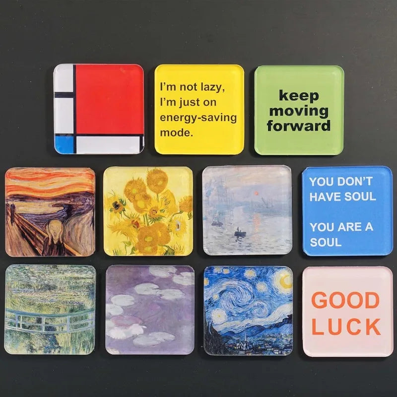 A collection of nine colorful acrylic fridge magnets featuring various text and abstract designs.