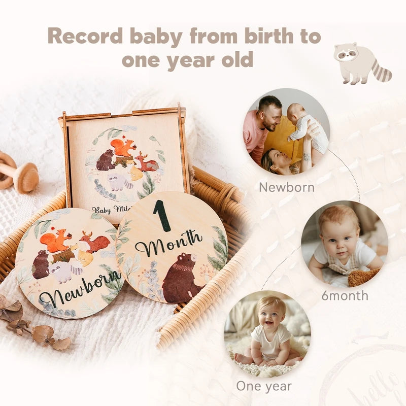 A set of wooden baby milestone cards and a keepsake box showing milestones from newborn to one year old.