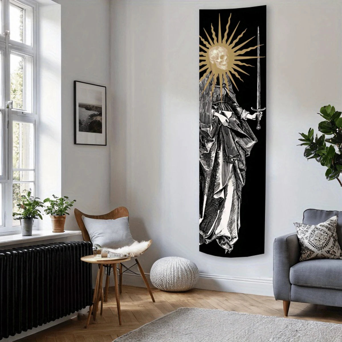 A black and white tapestry wall hanging depicting a sunburst with a skull and sword.