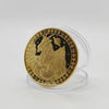 A round gold commemorative iron coin featuring a rampant lion and zodiac symbols on a clear stand.