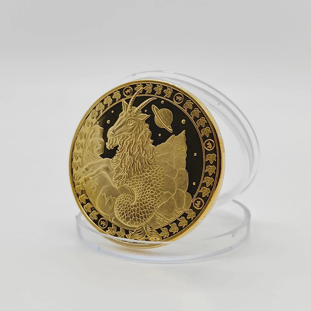 A round gold commemorative iron coin featuring a rampant lion and zodiac symbols on a clear stand.