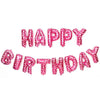 A set of pink and blue letter foil balloons spelling out Happy Birthday