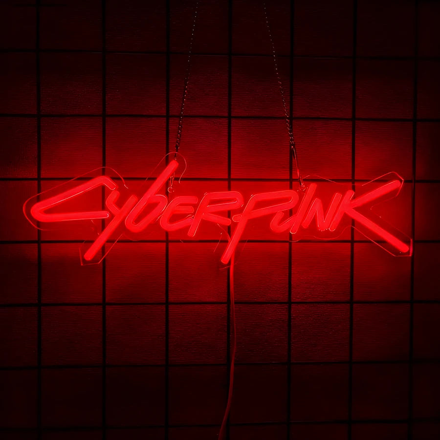 A neon sign spelling out CYBERPUNK is suspended against a dark red grid background.