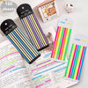 A collection of 160 transparent sticky strips and index tabs in various colors and designs arranged on a white surface.