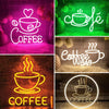 Various neon LED wall signs featuring the word COFFEE and coffee cup designs on pink, green, and yellow backgrounds.