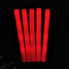 A set of red RGB glow foam sticks standing upright against a dark background.