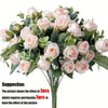 A bouquet of light pink silk roses and green eucalyptus leaves for wedding or home decor