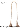 Boho farmhouse tassel bead wall hanging with a long string of light beige wooden beads and fringed tassels