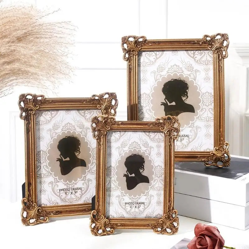 A set of elegant gold-framed resin photo frames featuring vintage European designs and silhouette portraits.