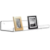 A clear acrylic floating storage rack set displaying two framed photos, one wooden and one black.