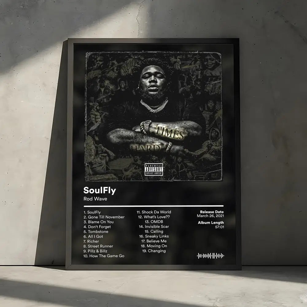 A framed black and white poster featuring the album art for SoulFly with track listings.