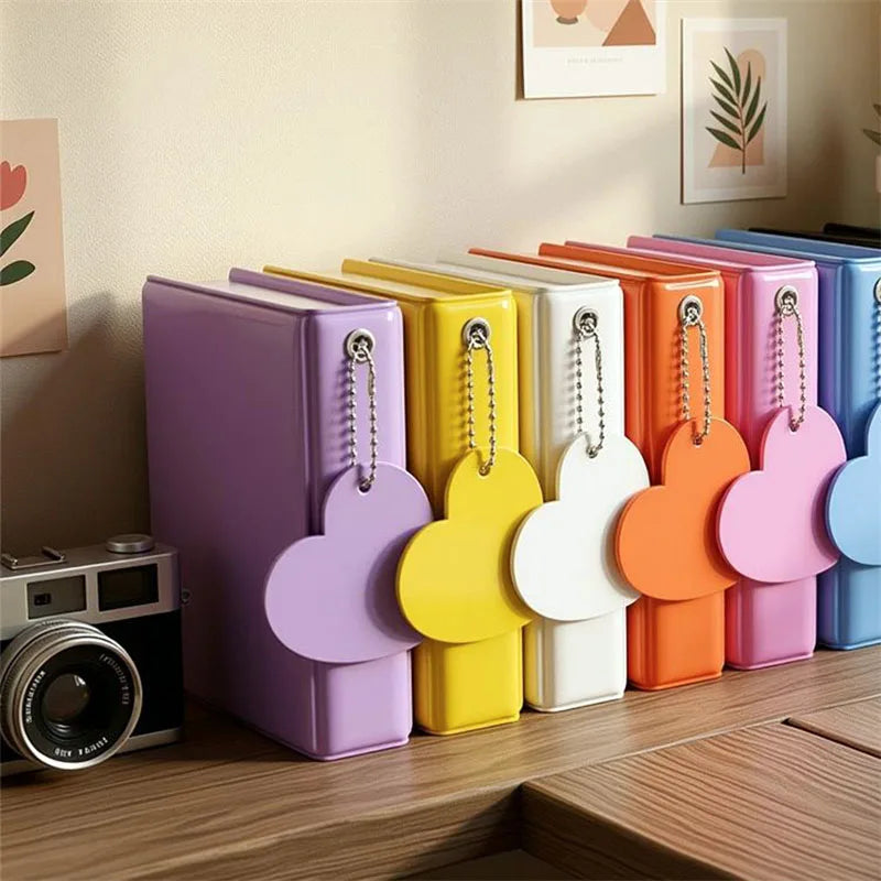 A row of colorful candy heart window photocard albums in various shades of purple, yellow, orange, and pink.