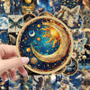 A hand holds a circular sticker featuring a stylized yellow and gold crescent moon with sun rays against a deep blue cosmic b