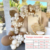 A display of beige and cream balloons arranged in a garland design against a light-colored wall.